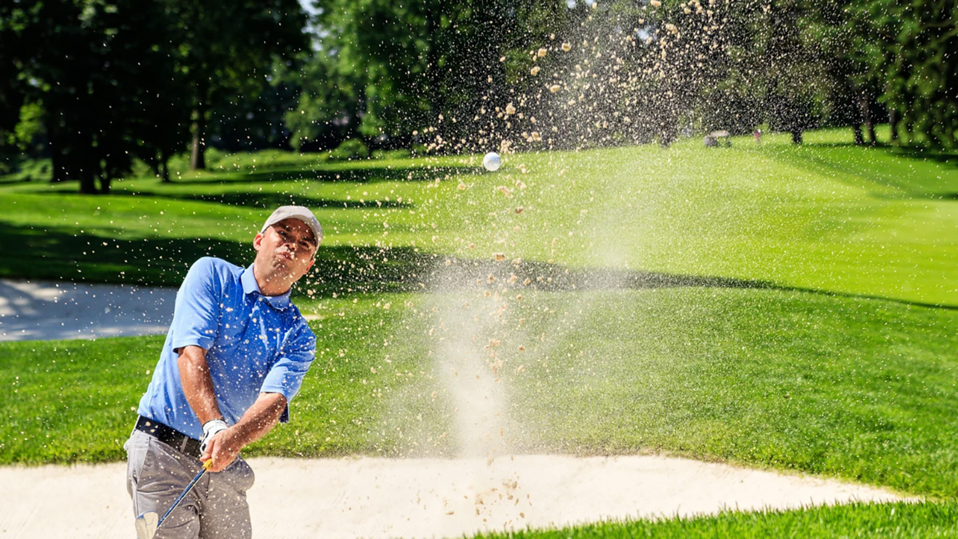 Man playing from sand trap