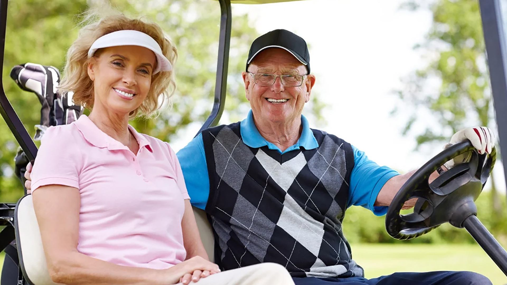 Man and woman in golf cart